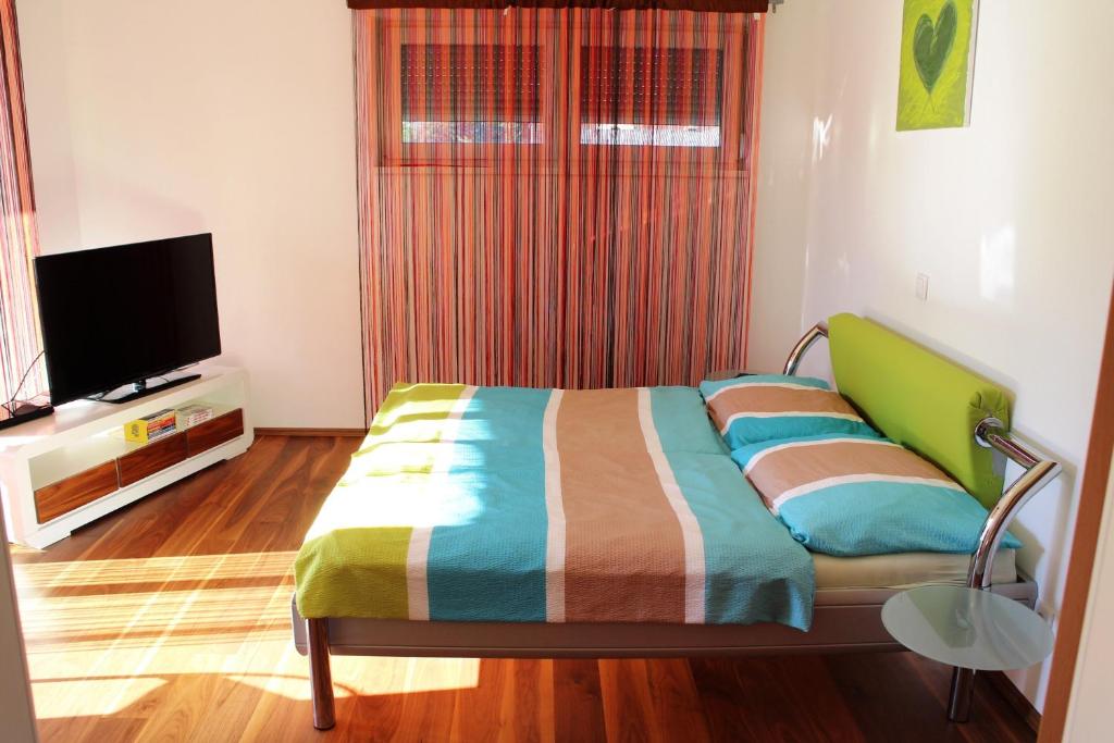 TV a/nebo společenská místnost v ubytování Villa Relax am See