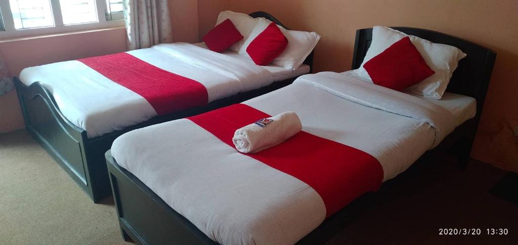 Postel nebo postele na pokoji v ubytování HOTEL ICE VIEW POKHARA