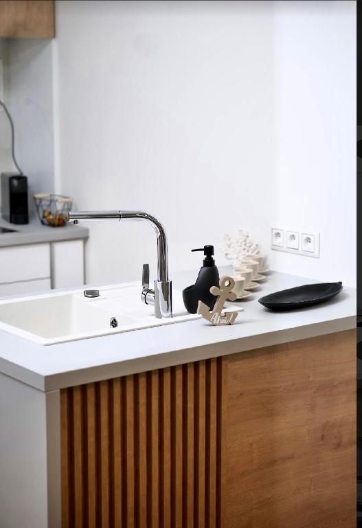 Kuchyň nebo kuchyňský kout v ubytování Napfény Resort Apartman