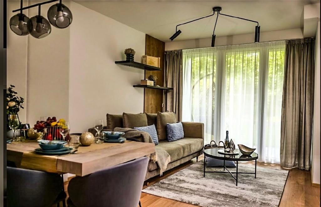 Posezení v ubytování Napfény Resort Apartman