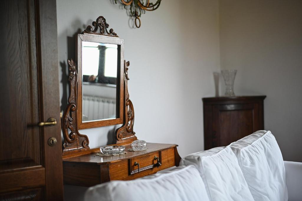A bed or beds in a room at Melograno Poderone