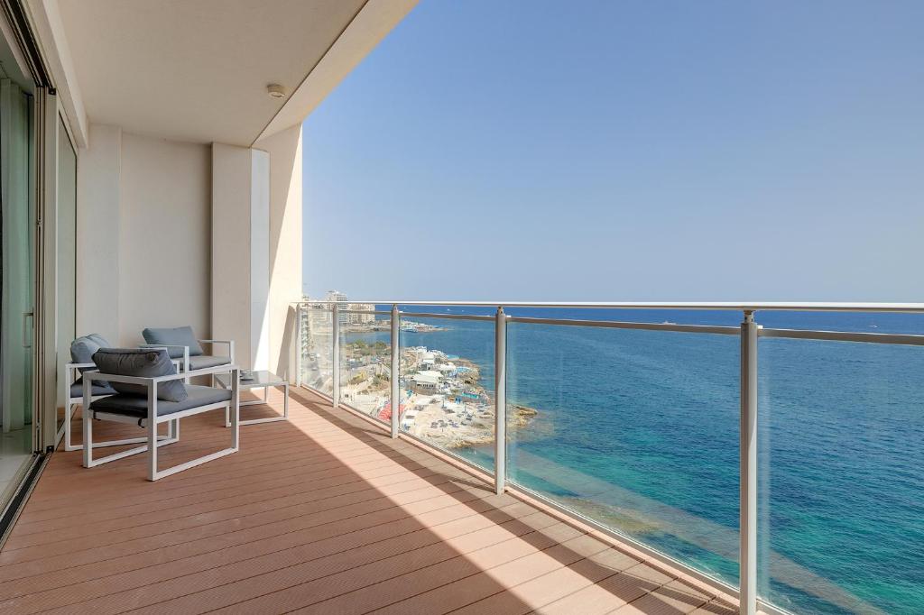 a balcony with a view of the ocean at Super Luxury Apartment in Tigne Point, Amazing Sea Views in Sliema