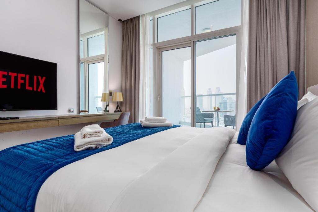 Postel nebo postele na pokoji v ubytování Vacay Lettings - Damac Prive studio