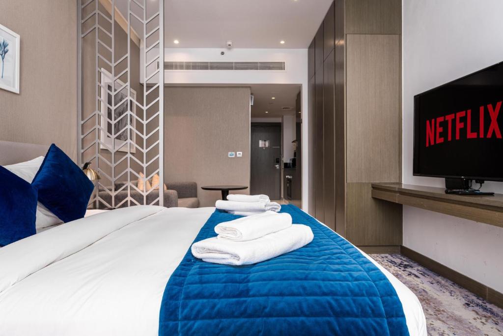Postel nebo postele na pokoji v ubytování Vacay Lettings - Damac Prive studio