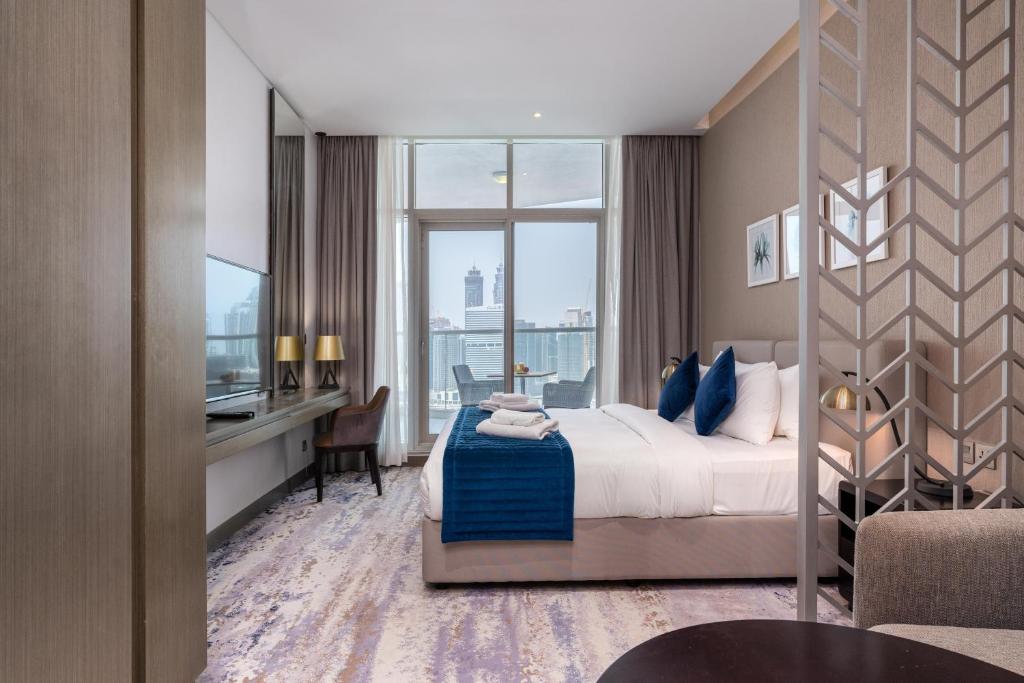 Postel nebo postele na pokoji v ubytování Vacay Lettings - Damac Prive studio