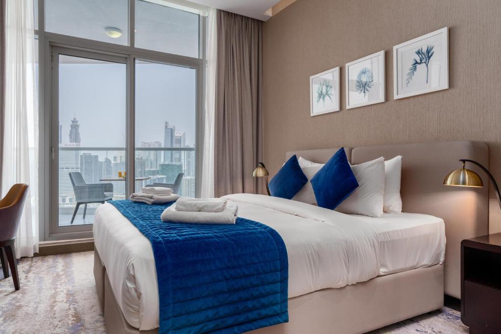 Postel nebo postele na pokoji v ubytování Vacay Lettings - Damac Prive studio