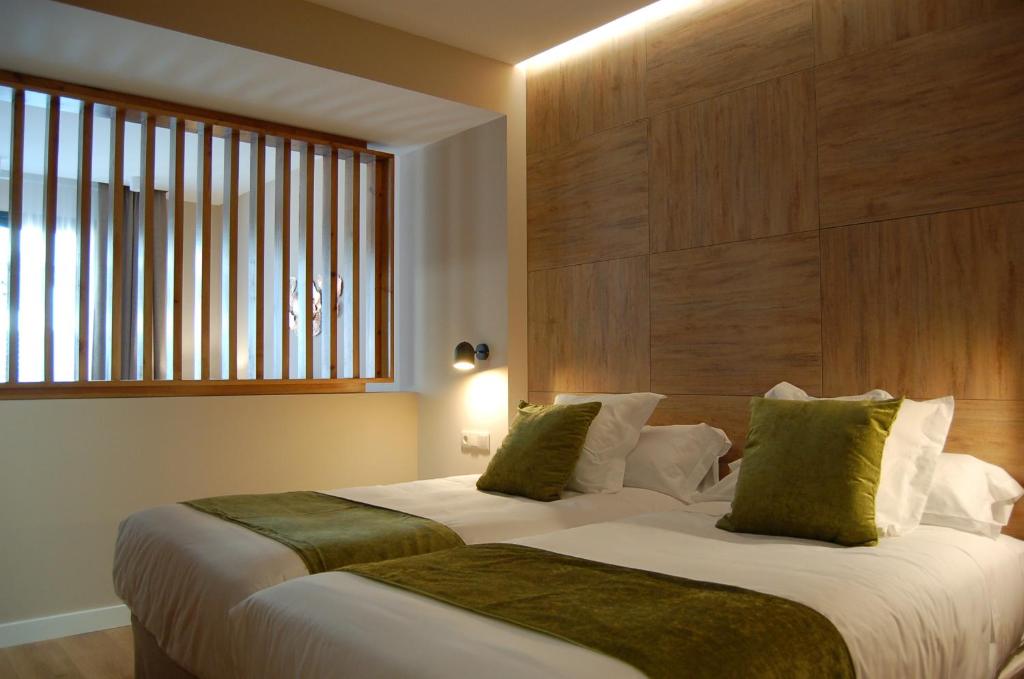 Postel nebo postele na pokoji v ubytování Dauria Suites HA