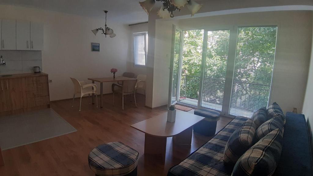 a living room with a couch and a table at Apartment V in Ohrid