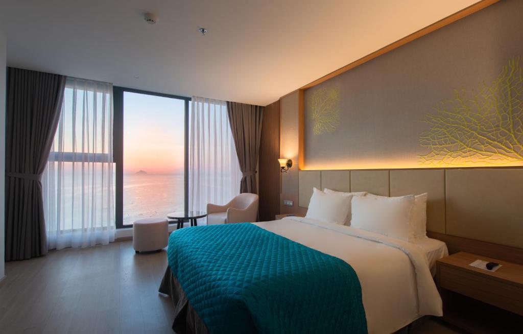 Postel nebo postele na pokoji v ubytování Navada Beach Hotel