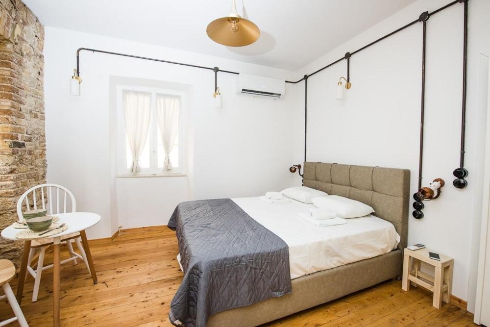 A bed or beds in a room at Calista Liston Corfu 2