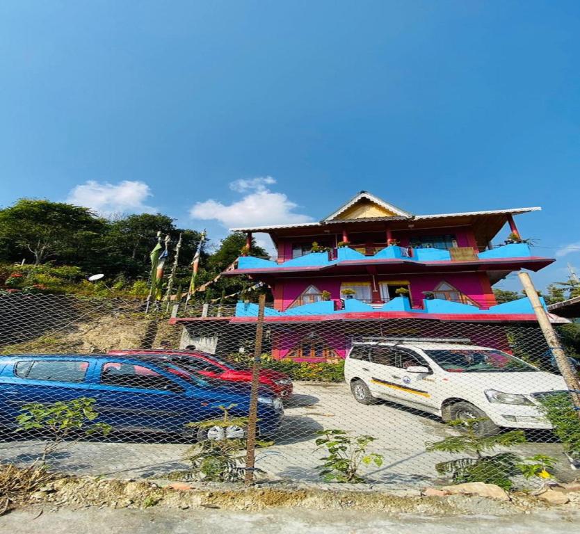 a building with a car parked in front of it at Blone Homestay by StayApart in Māngwa