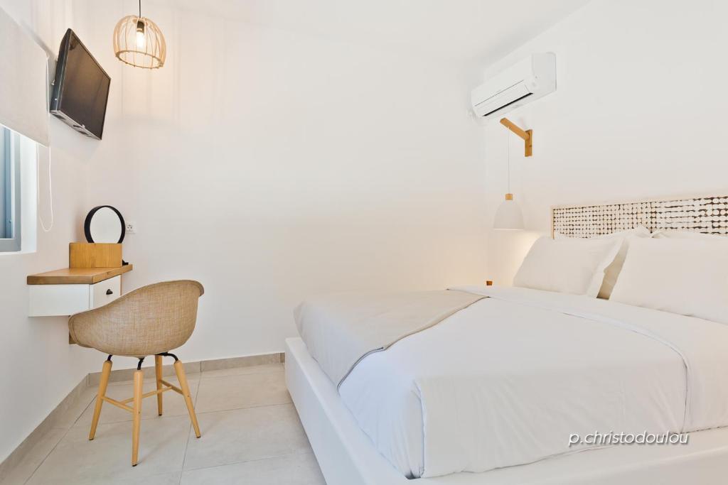 Postel nebo postele na pokoji v ubytování Agnantema luxury suites