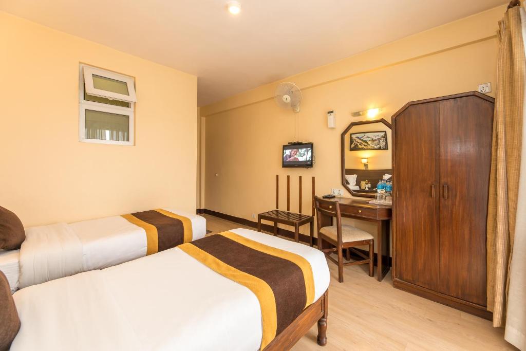 Postel nebo postele na pokoji v ubytování Hotel Thamel