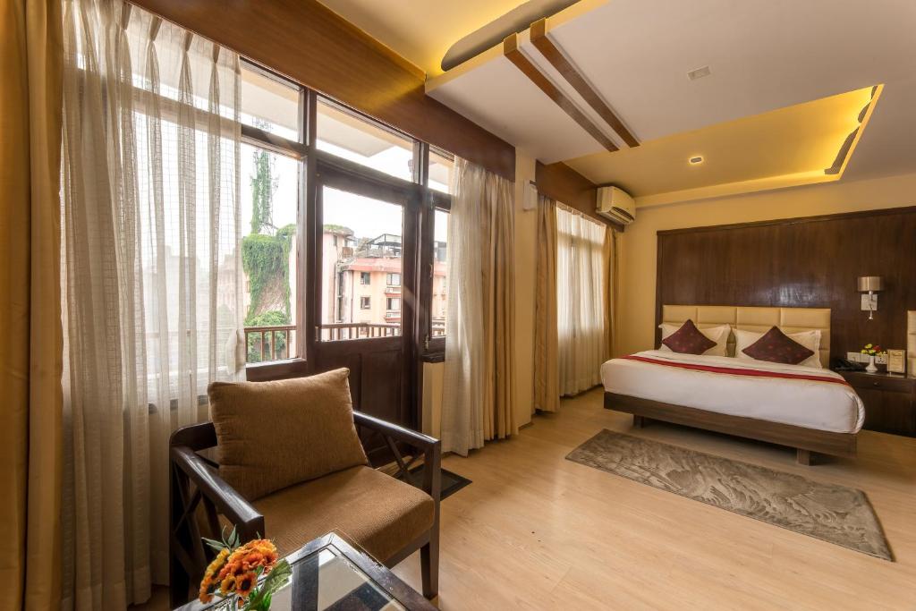 Postel nebo postele na pokoji v ubytování Hotel Thamel