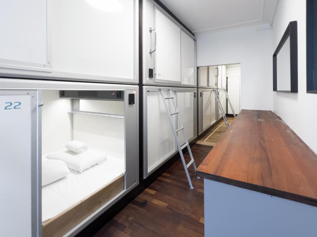 a kitchen with a refrigerator and a counter top at Copenhagen Backpackers Hostel in Copenhagen