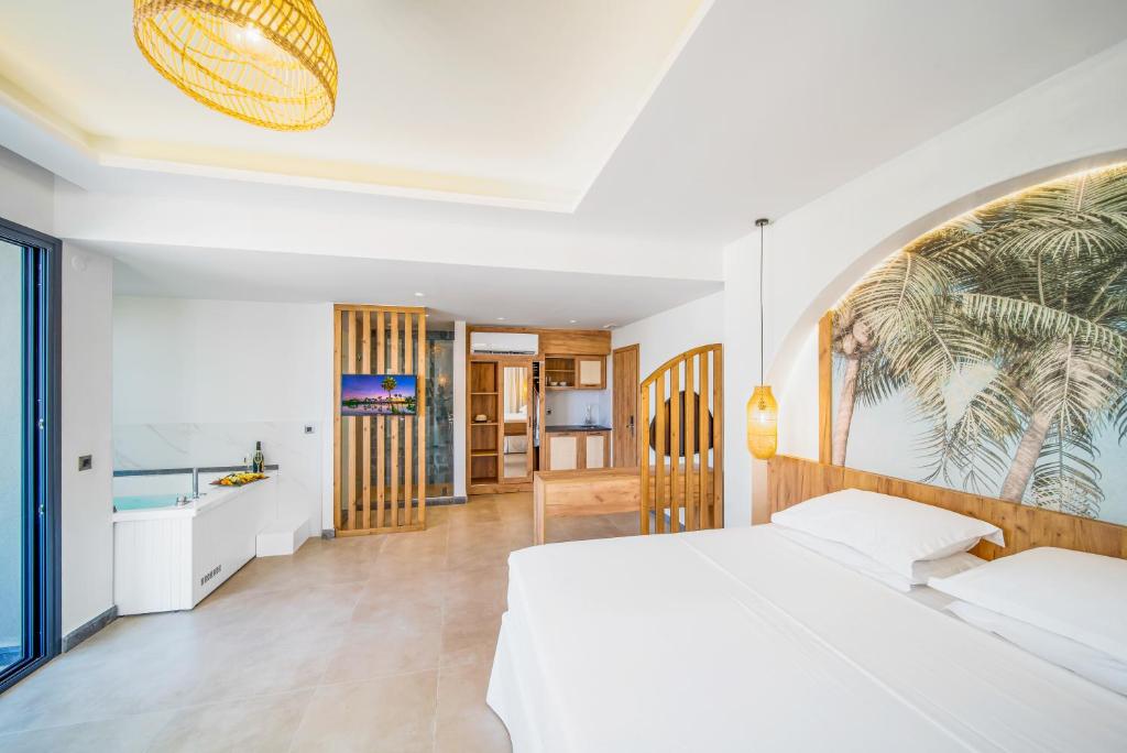 1 dormitorio con cama blanca y baño en Drossia Residenza Boutique Hotel Malia en Mália