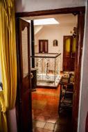 an open door to a room with a yellow curtain at Casa La Palma in Chefchaouene