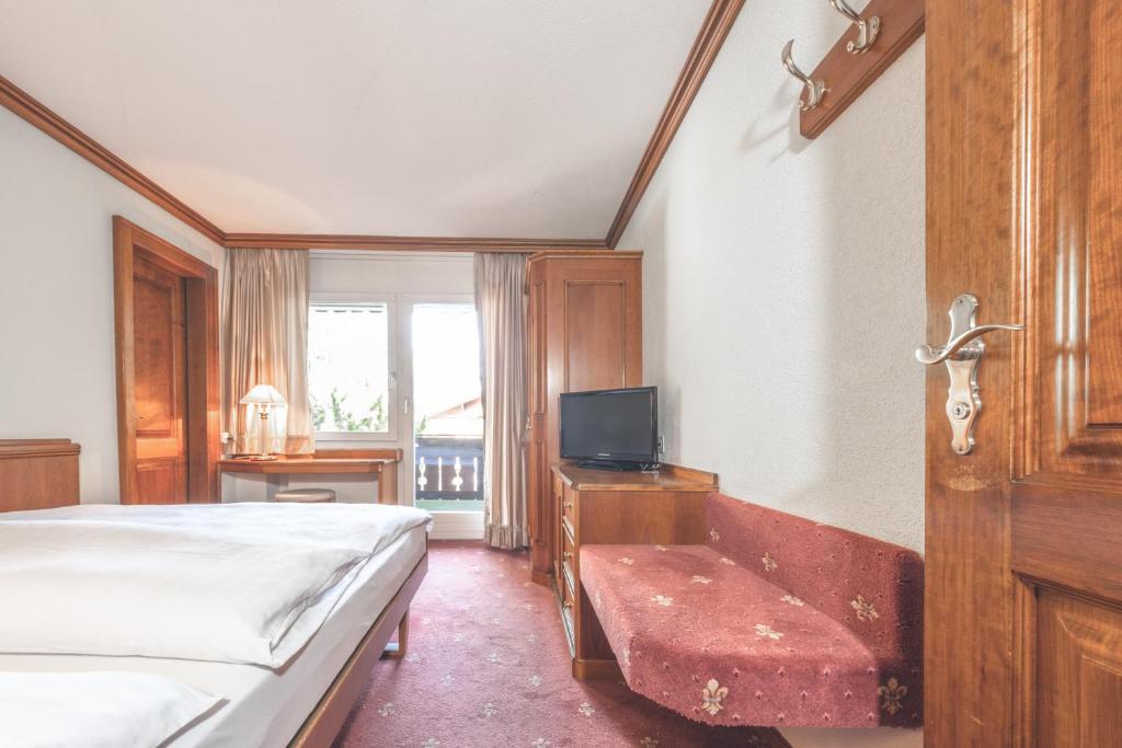 Postel nebo postele na pokoji v ubytování Antares Hotel