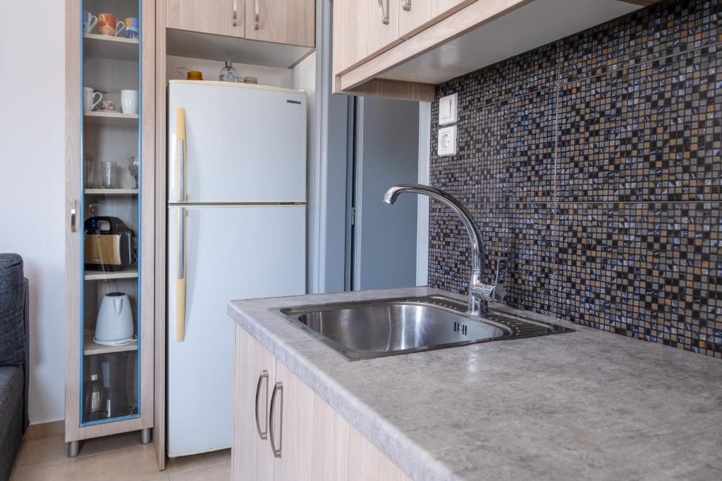 Kuchyň nebo kuchyňský kout v ubytování Adelphi Apartments