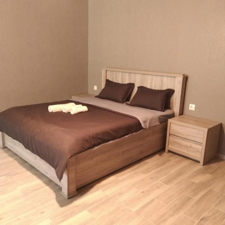 Postel nebo postele na pokoji v ubytování Nikolozi