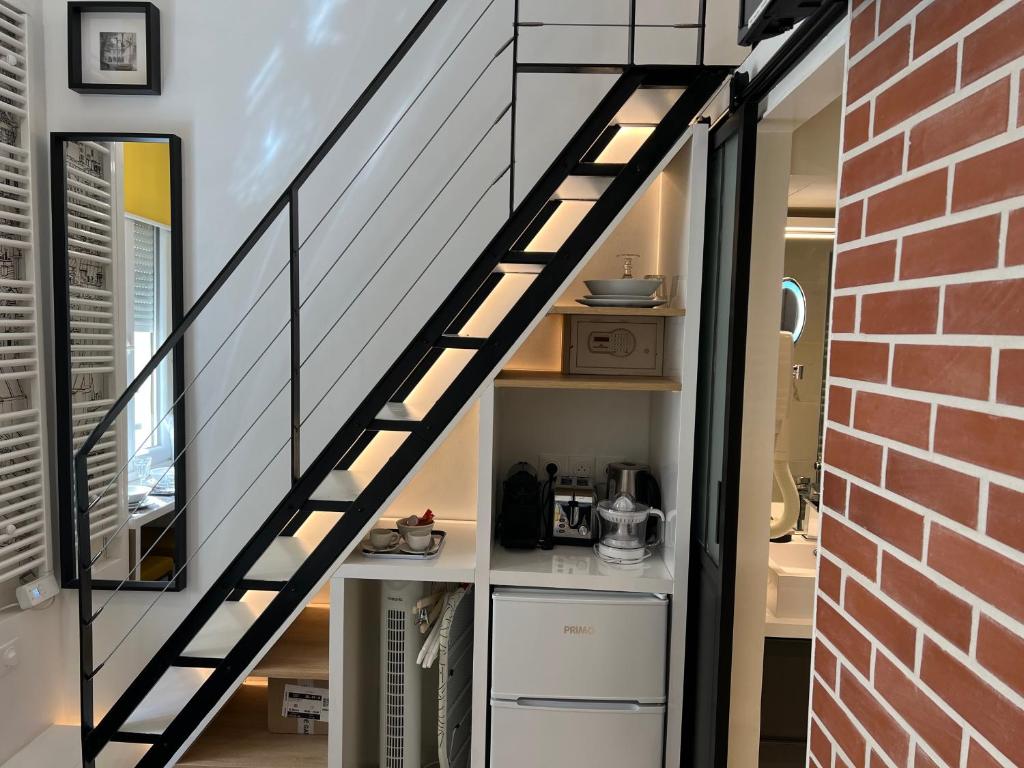 Kuchyňa alebo kuchynka v ubytovaní Studio Cléry