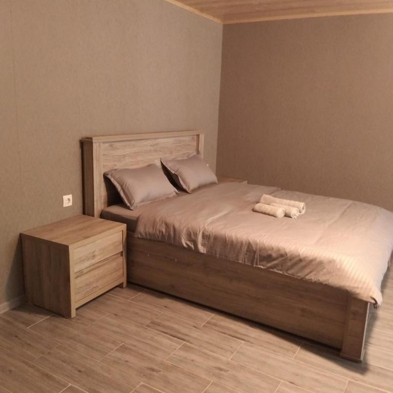 Postel nebo postele na pokoji v ubytování Nikolozi