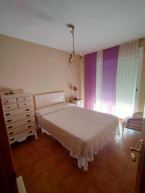 Postel nebo postele na pokoji v ubytování En la gloria.