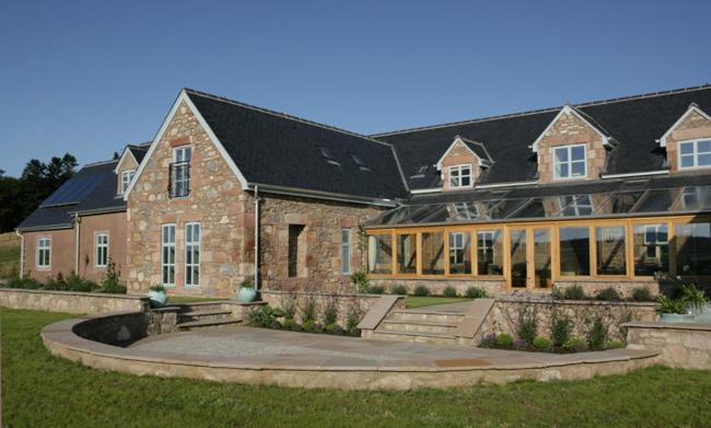 a large brick building with a courtyard in front of it at Quarryfield in Inverness