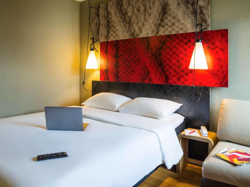 Letto o letti in una camera di Ibis Sion