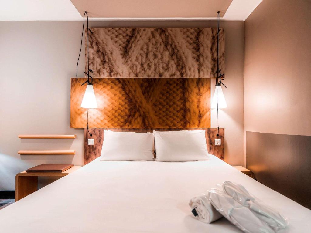 Postel nebo postele na pokoji v ubytování Ibis Den Haag City Centre