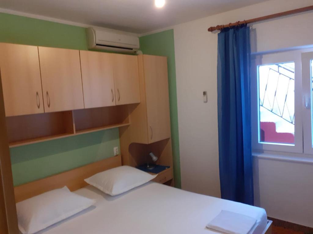 Postel nebo postele na pokoji v ubytování City Apartment Damir