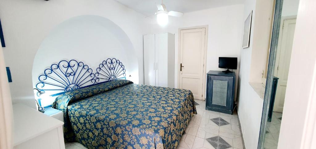 Postel nebo postele na pokoji v ubytování Hotel Poseidon