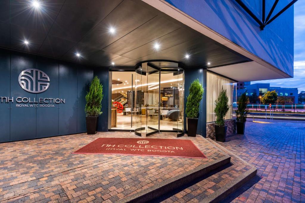 a building with a sign in front of it at NH Collection Bogota WTC Royal in Bogotá