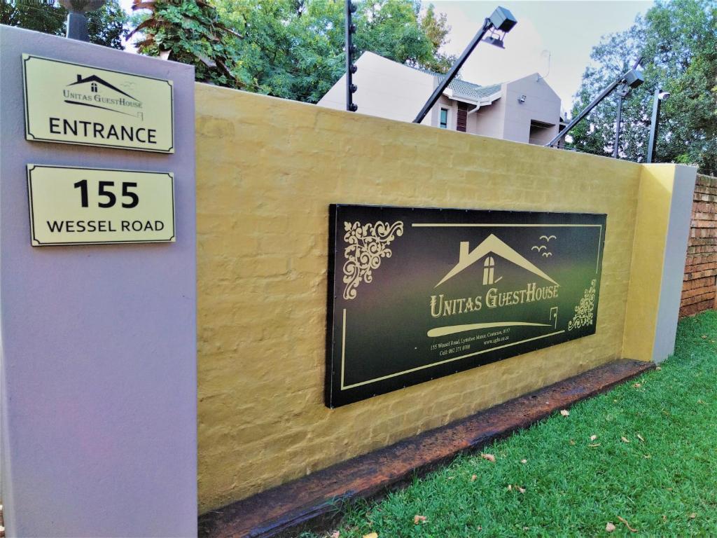 a sign that reads entrance to a house at Unitas Guesthouse in Centurion