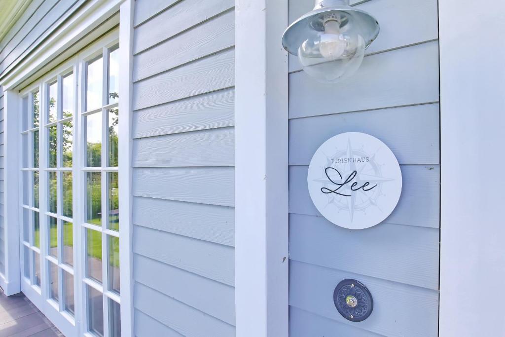 a front door of a house with a sign that reads happy new lease at Redewisch Lee und Luv Ferienwohnung Lee in Redewisch