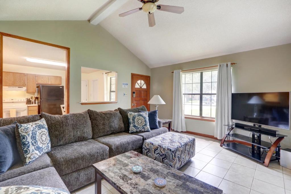 a living room with a couch and a flat screen tv at Pooler Travelers Retreat IV - Entire House - in Savannah
