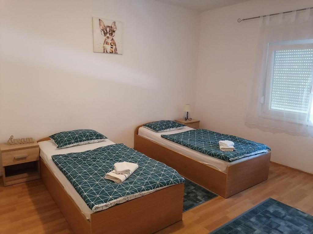 Postel nebo postele na pokoji v ubytování Apartments Zdenka