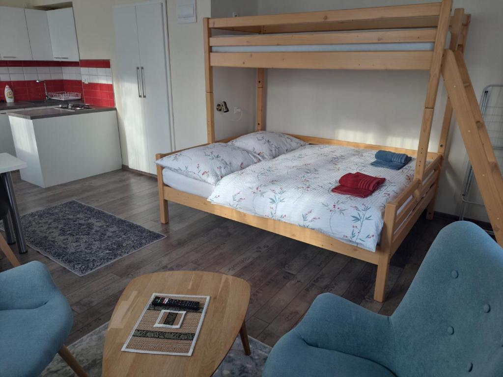 Postel nebo postele na pokoji v ubytování Apartmány U Mariánské kaple