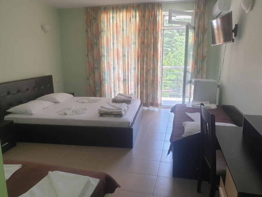 Postel nebo postele na pokoji v ubytování Hotel Maria
