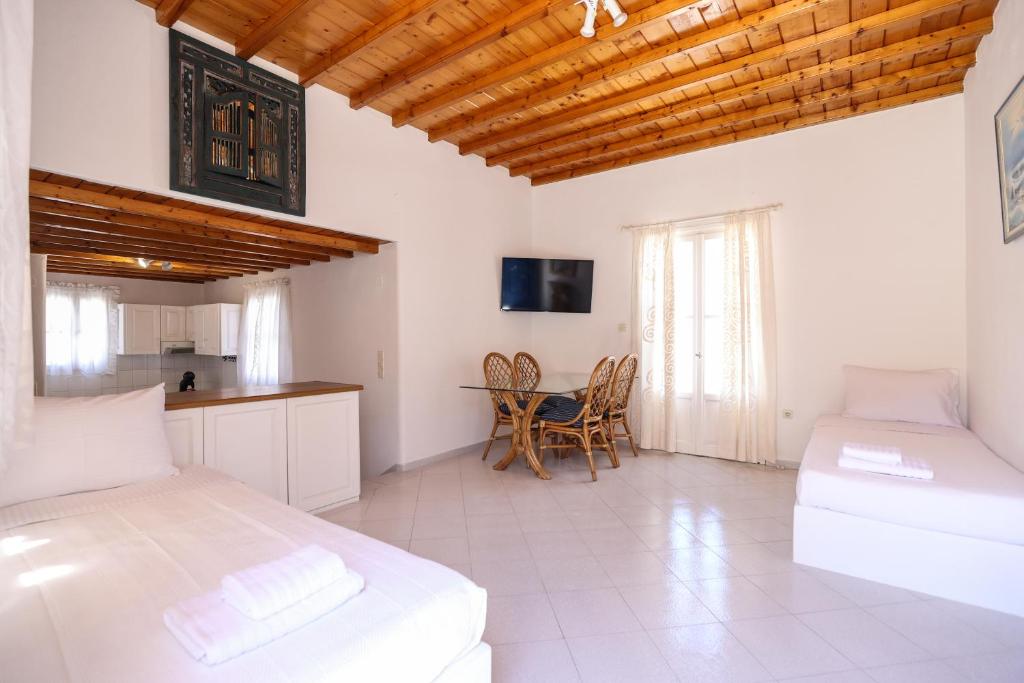 Voodi või voodid majutusasutuse Mykonos in White toas