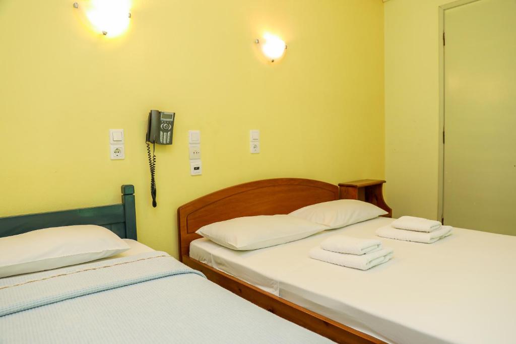 Postel nebo postele na pokoji v ubytování Hotel Aggeliki