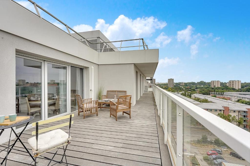 Een balkon of terras bij LE COSMOPOLIS - Charmant appartement toulousain de 89m2