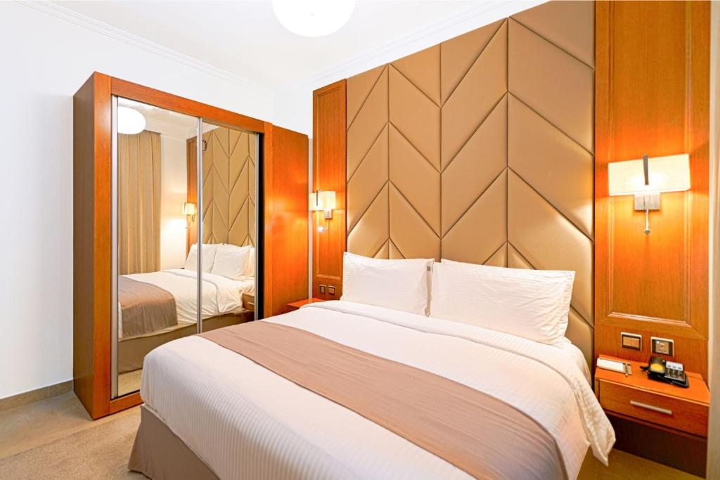 Postel nebo postele na pokoji v ubytování TIME Moonstone Hotel Apartments