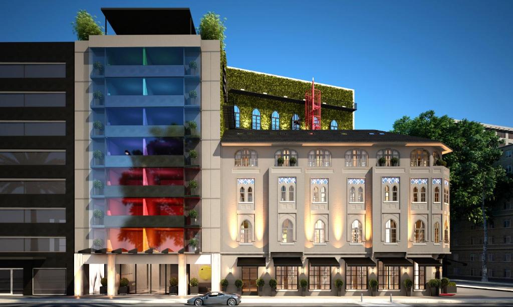 a rendering of a building next to a tall building at EN Hotel Boutique Izmir in Konak