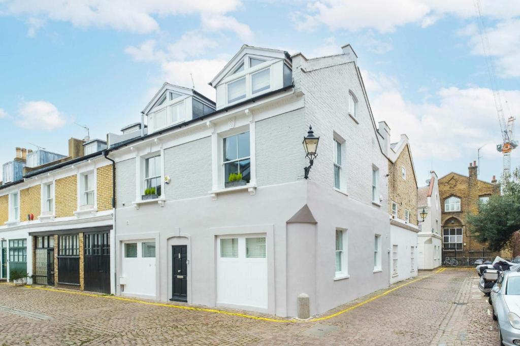 a white building with a lot of windows at NEW Stunning 5BD Mews House in London