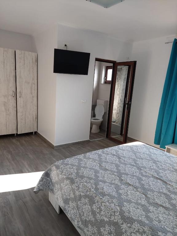 Postel nebo postele na pokoji v ubytování ALBDEVARA MAR SRL