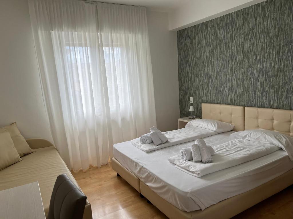 Postel nebo postele na pokoji v ubytování Albergo San Remo