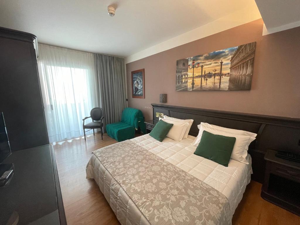 Postel nebo postele na pokoji v ubytování Park Hotel Cellini