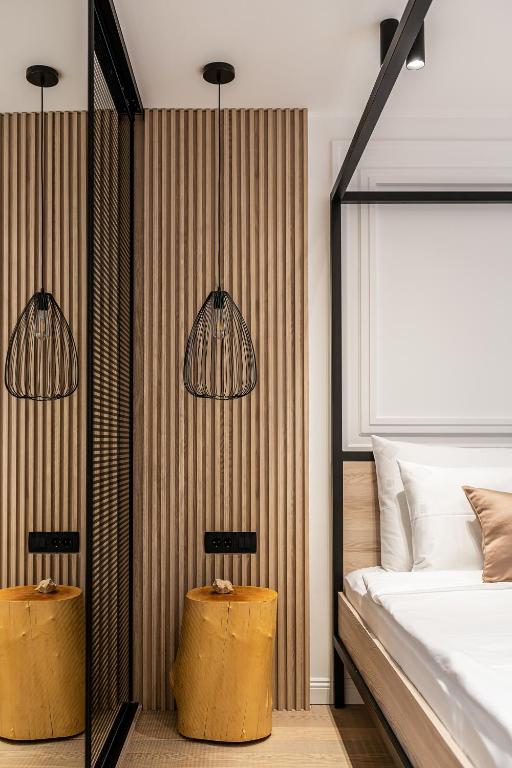 a bedroom with two lamps and a bed at Blanche Cliff Apartments in Sveti Stefan