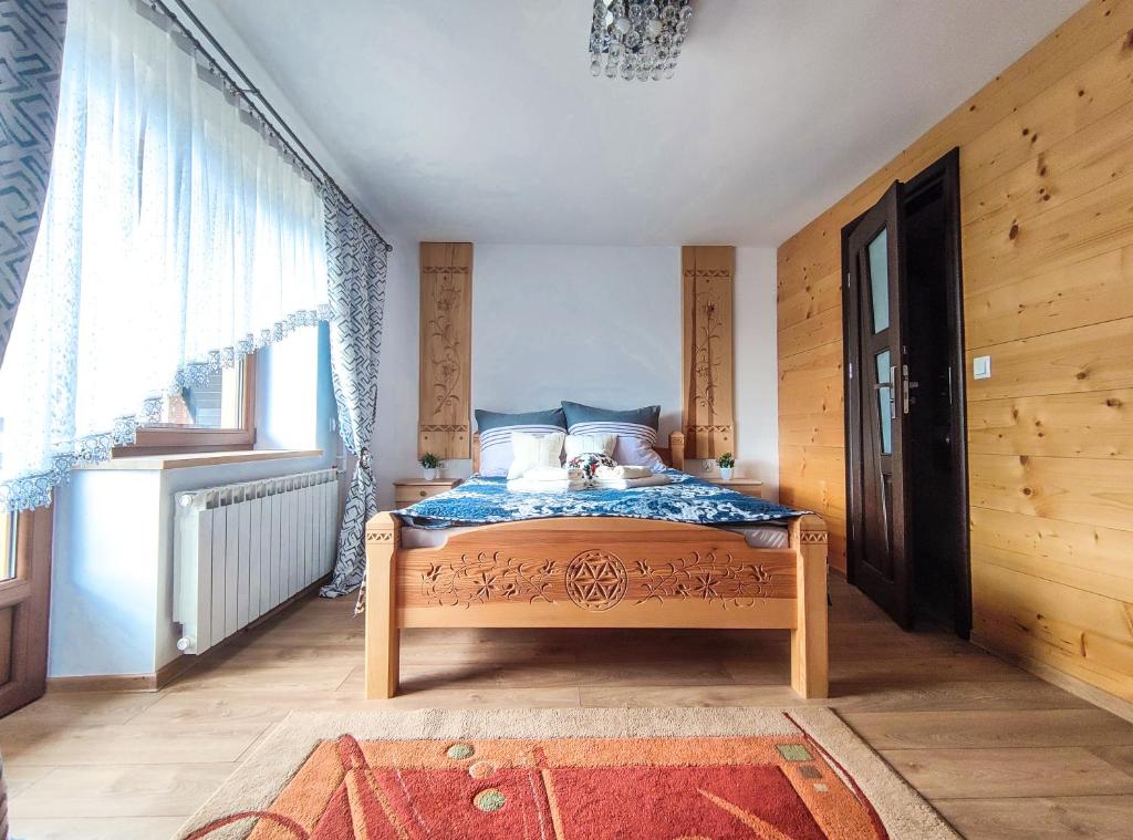 Posteľ alebo postele v izbe v ubytovaní Szostak Apartament